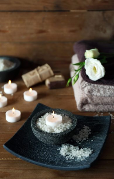 Beautiful spa composition with candles on wooden background